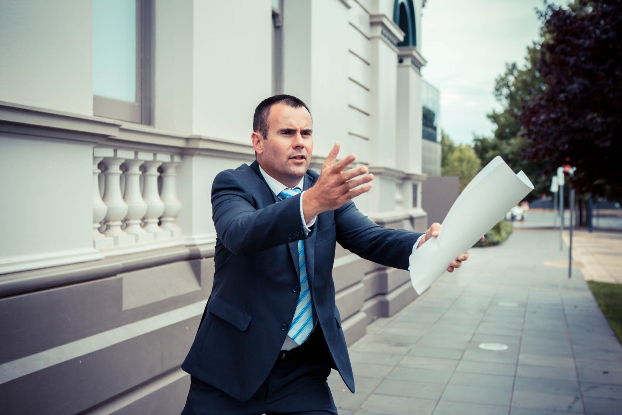 Angus Macleod calling an auction in the street